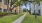 walkways and green turf in between property buildings